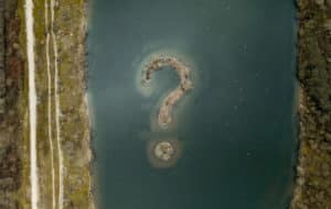 river with question mark as an island
